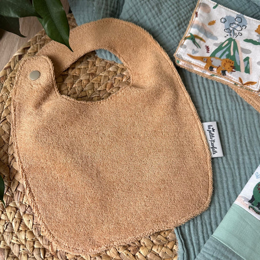 bavoir deux pressions avec éponge biologique motif dinosaures